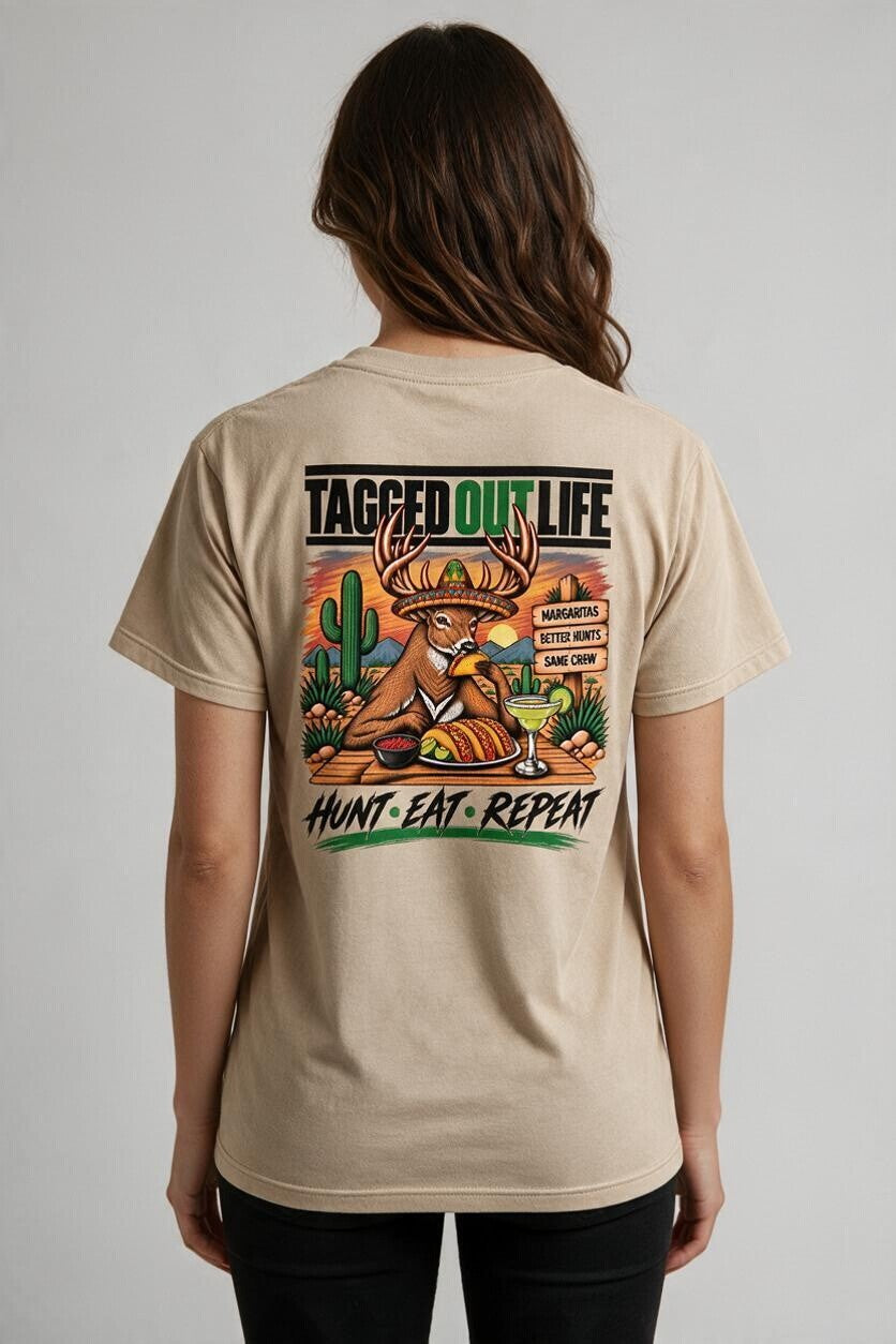 Tagged Out Life beige unisex short-sleeve t-shirt with a back graphic of a deer drinking a margarita in the desert.