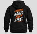 Tagged Out Life black unisex hunting hoodie featuring a back graphic with orange and white rifle-themed text