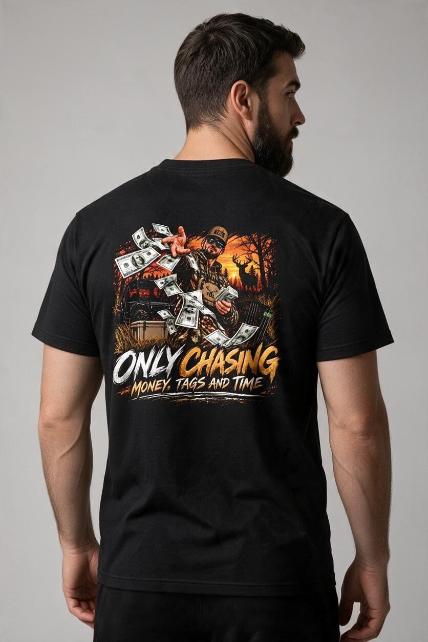 Tagged Out Life black unisex t-shirt featuring a humorous hunting graphic of a hunter, buck, and flying money on back