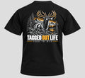 Tagged Out Life black unisex t-shirt featuring a back graphic of a bugling elk in a mountain forest landscape.