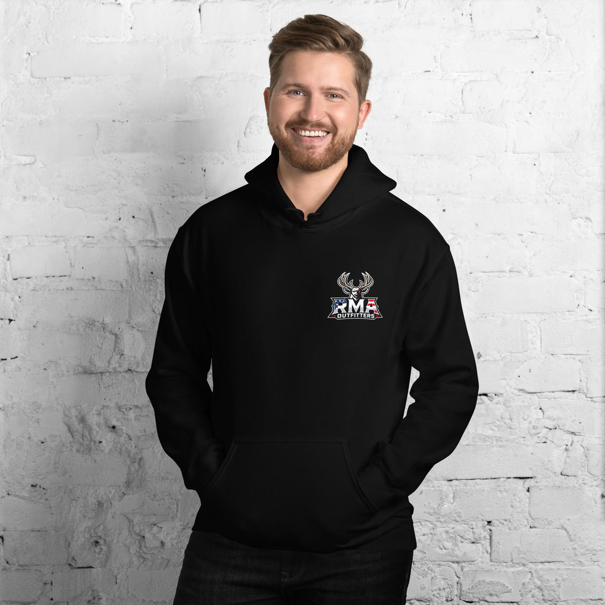 Man wearing a black Tagged Out Life RMA Outfitters NW Missouri unisex hunting hoodie with a deer antler and flag logo